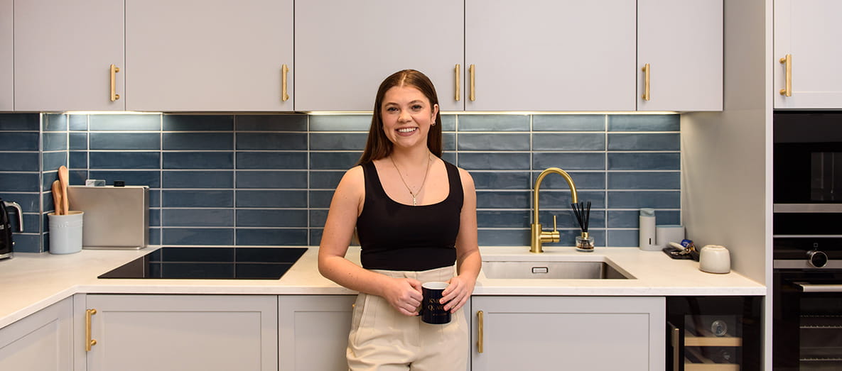 Salin Kaya, a 24-year-old homeowner, in the kitchen of her new home at Knights Quarter, a development by Berkeley Group.