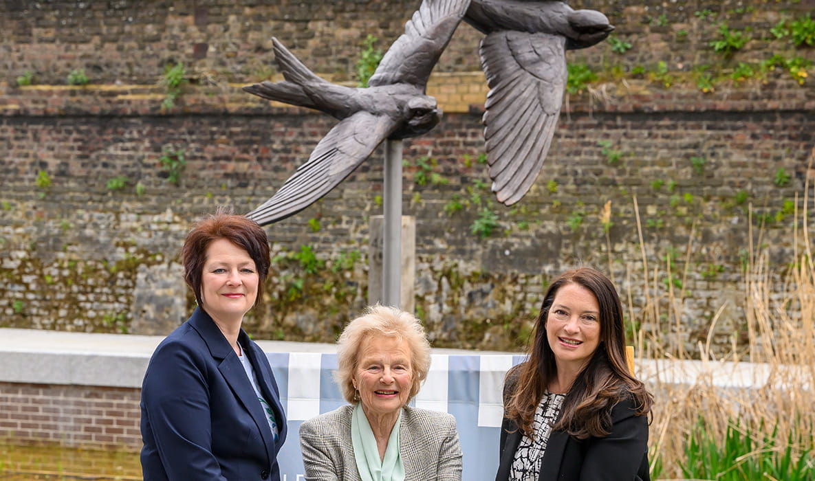 Image of people in front of the newly unveiled sculpture