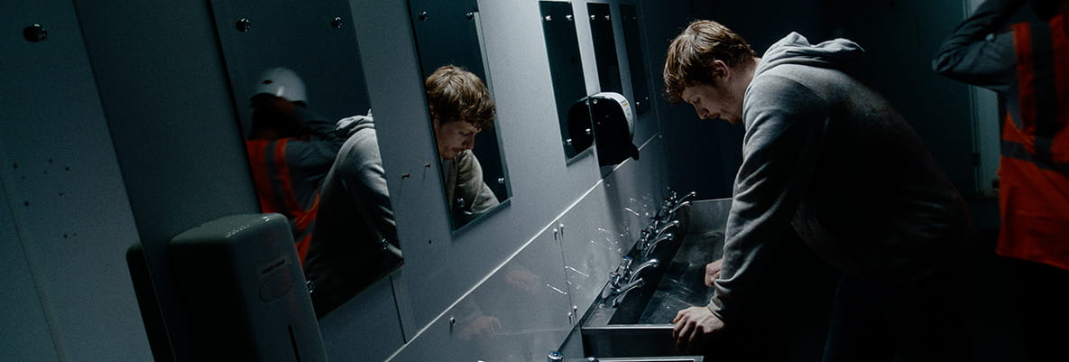 An image of a construction worker suffering from slavery in the workplace