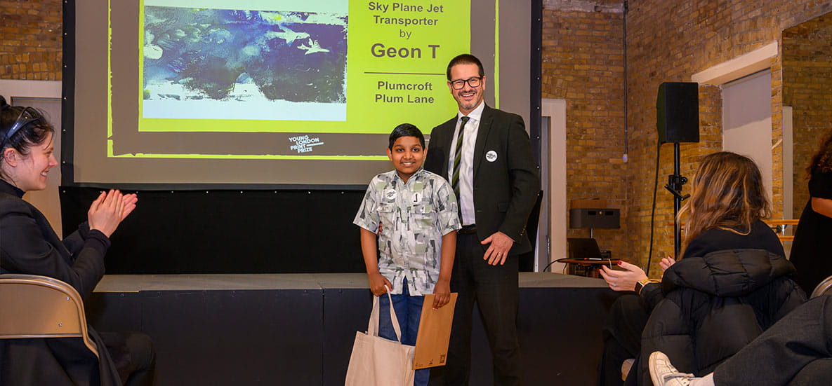 An image of the director handing out prizes