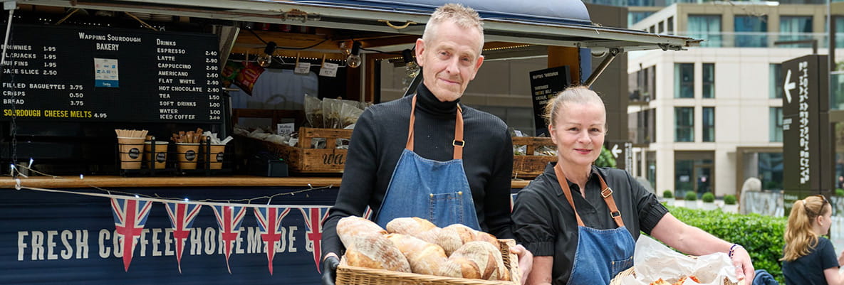 An image of sourdough suppliers posing in front of their baked goods van