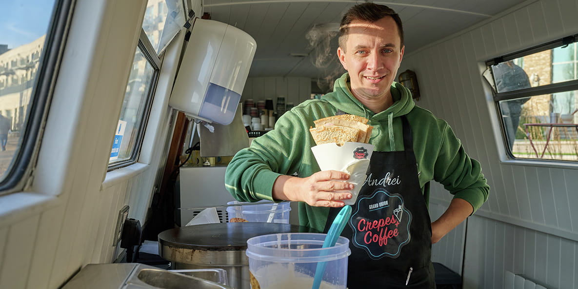 An image of Andrei holding a crepe in the narrowboat