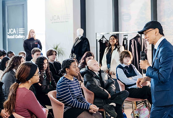 Fulham Cross School students listening to insights from Prof. Jimmy Choo