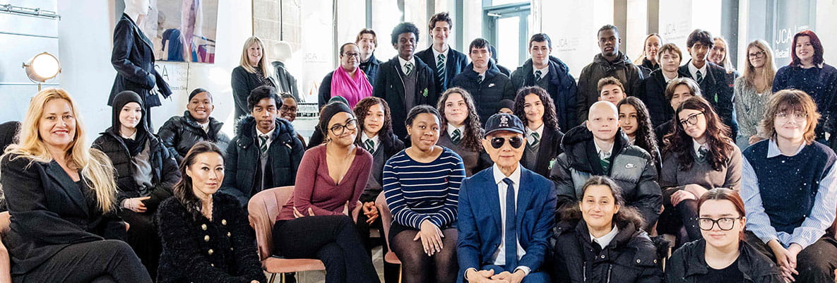 Fulham Cross School students taking a photo with Prof. Jimmy Choo
