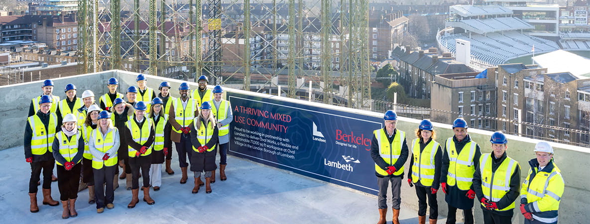 Image of Berkeley Directors and construction workers posing on Oval Village's rooftop