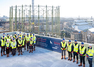 Image of Berkeley Directors and construction workers posing on Oval Village's rooftop