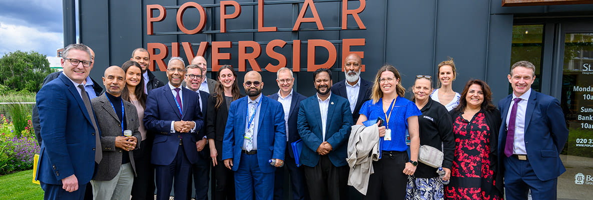 An image of everyone celebrating the new affordable homes at Poplar Riverside