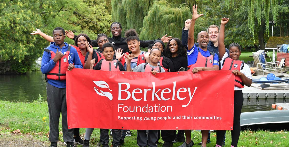 An image of people holding a Berkeley Foundation banner