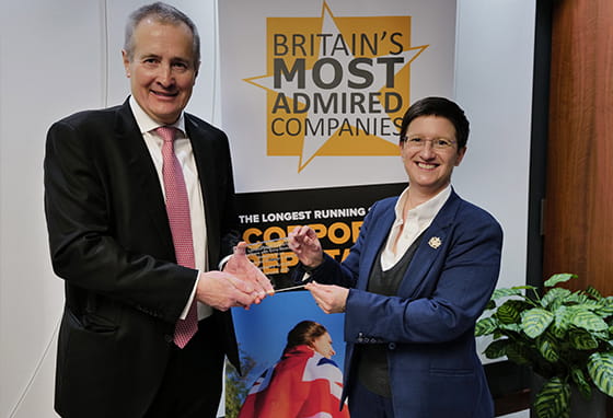 An image of Rob Perrins receiving the award for Britain's Most Admirable Companies