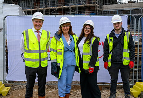 An image of the Chancellor with people from the Berkeley Group at Glasswater Locks