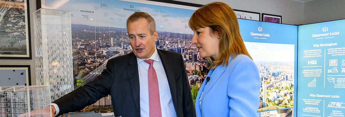An image of Rob Perrins and the Chancellor looking at the Glasswater Locks development model