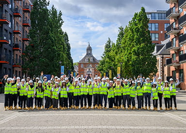 An image of the graduates for the Berkeley Group Graduate Scheme standing in PPE