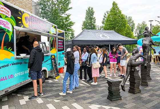 An image of people queuing for the food truck at Grand Union