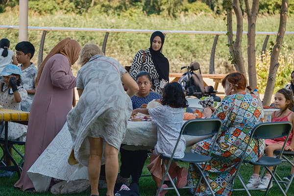 An image of local residents gathering at a park bench