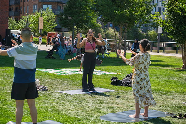 An image of an outdoor yoga class in session
