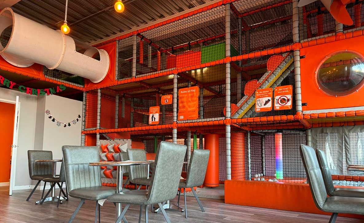An image of the orange soft play area in the new play cafe at Grand Union