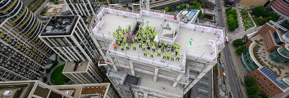 An image of St James workers and partners at White City Living at the top of The Solaris building