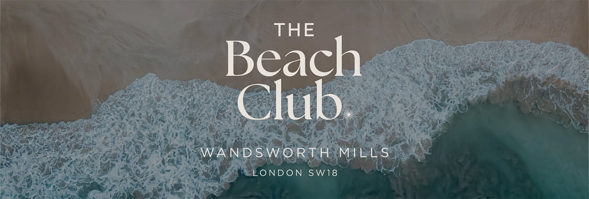 An image of the sea hitting the sand with The Beach Club logo overlayed