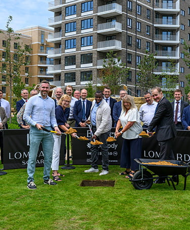 An image of the people celebrating the delivery of the new homes