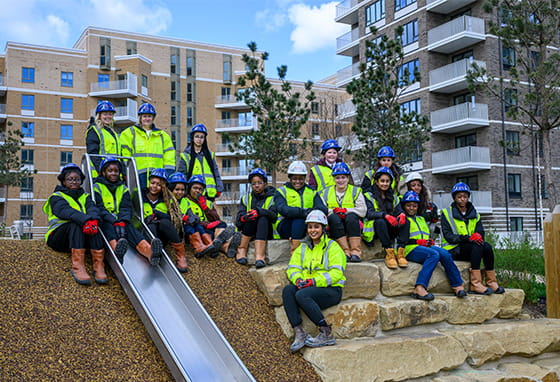 An image of people in PPE at the childrens play area at Lombard Square