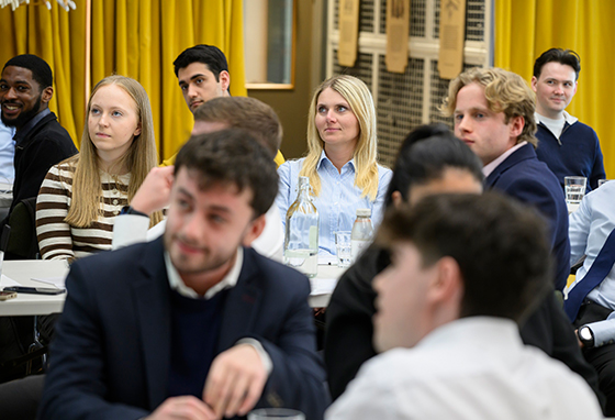An image of apprentices sat in a meeting