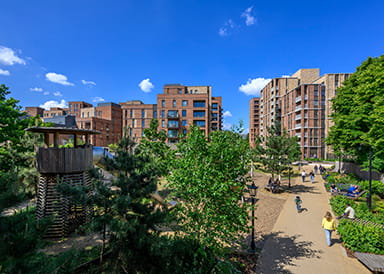 An exterior photograph of a play area in green space at Kidbrooke Village