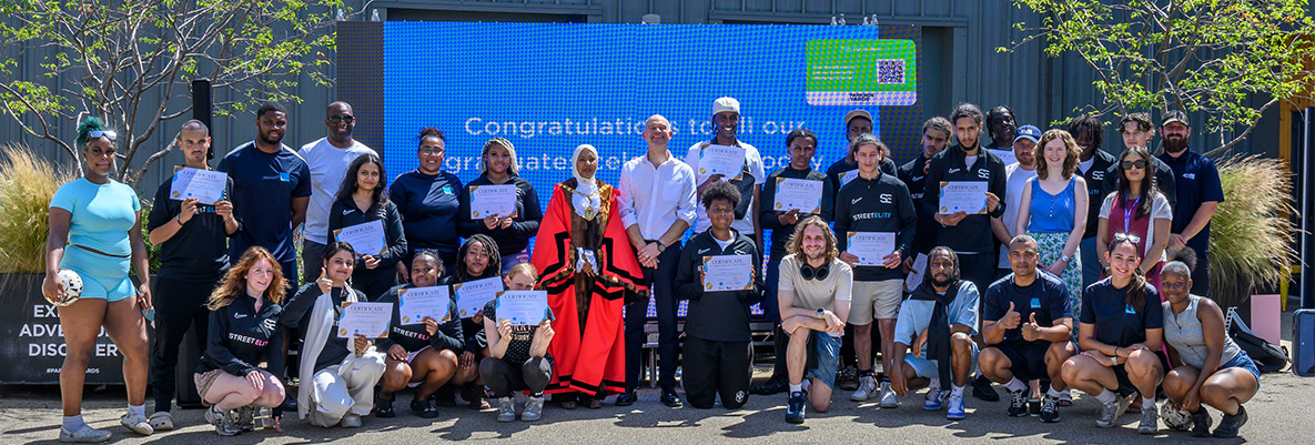 Group photo of participants and representatives for The Green Quarter Street Elite Graduation Ceremony, in Ealing.