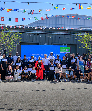 Group photo of participants and representatives for The Green Quarter Street Elite Graduation Ceremony, in Ealing.