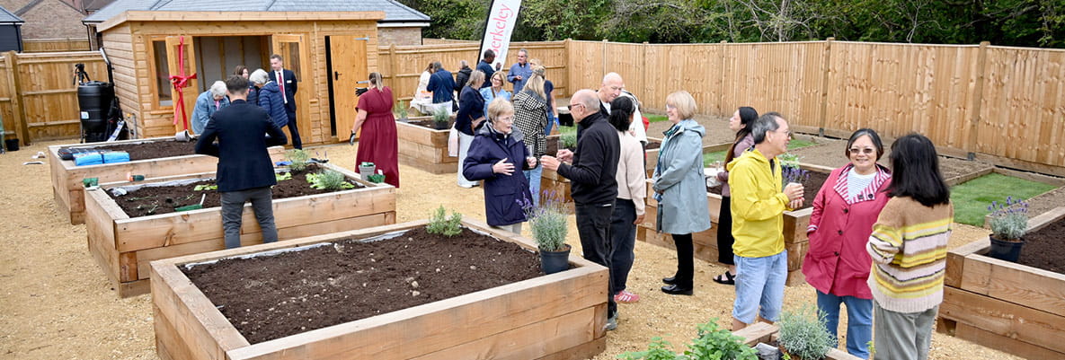 Residents gathered at the Leighwood Fields community gardens opening.