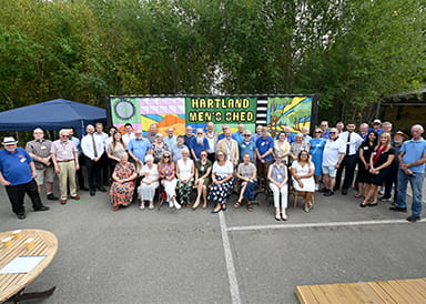 An image of people at the Men's Shed at Hartland Village