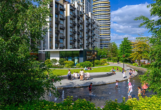 An exterior image of White City Living on a sunny day showing the green space