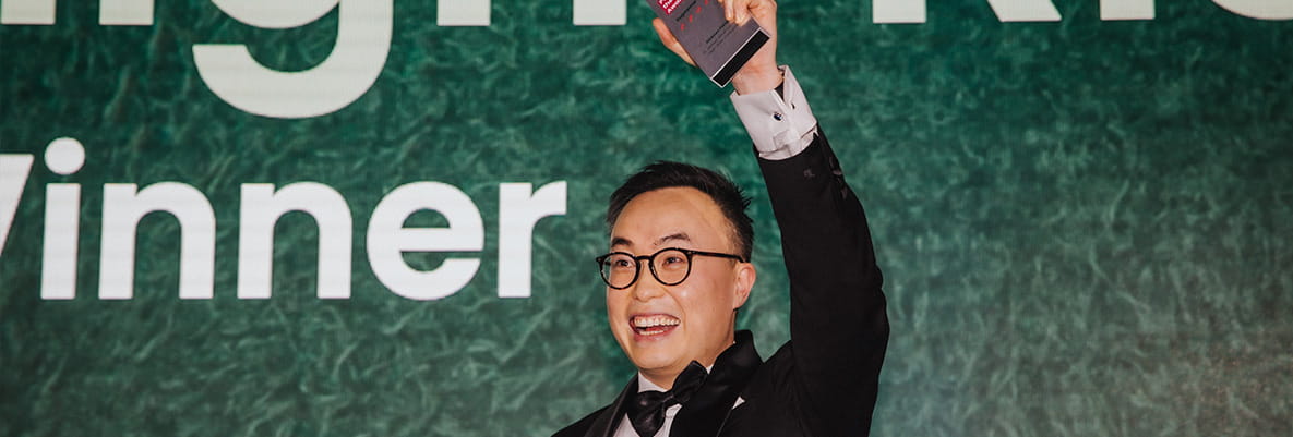 An image of the Senior Project Manager with the winners awards