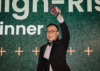 An image of the Senior Project Manager with the winners awards