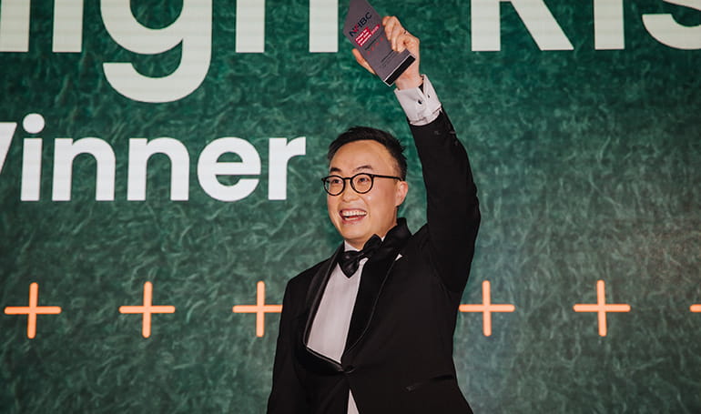 An image of the Senior Project Manager with the winners awards